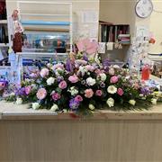 Pastel casket spray